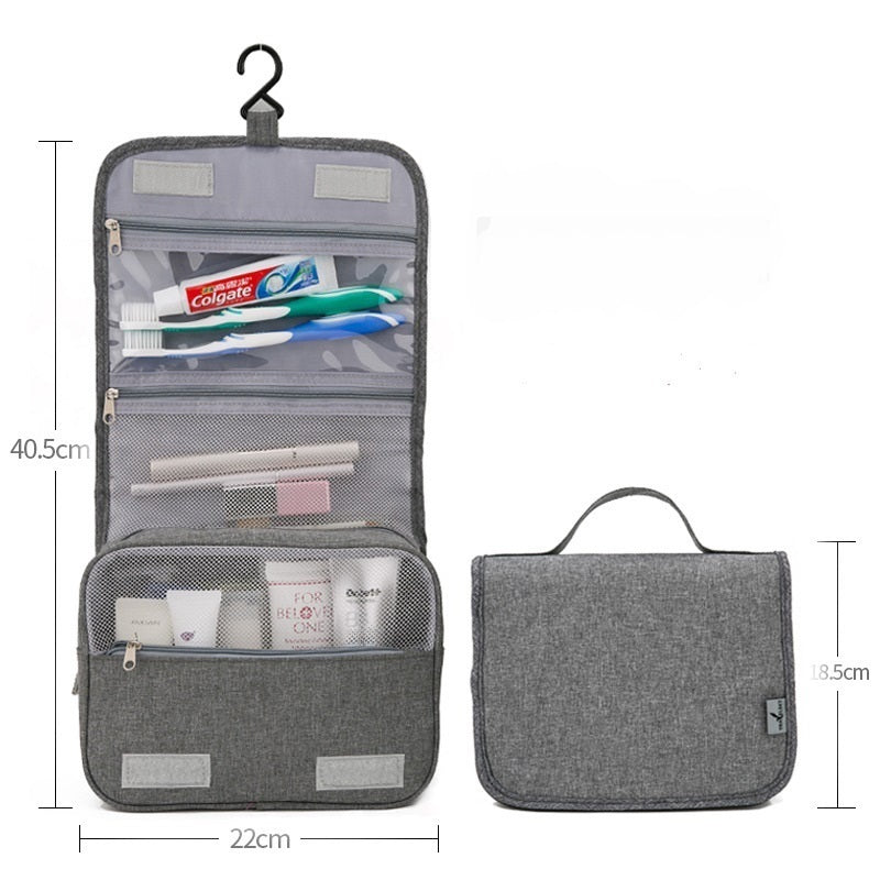 Pochette murale de rangement grise avec ses dimensions : 40,5 cm ouverte, 22 cm de large, 18,5 cm repliée avec poignée