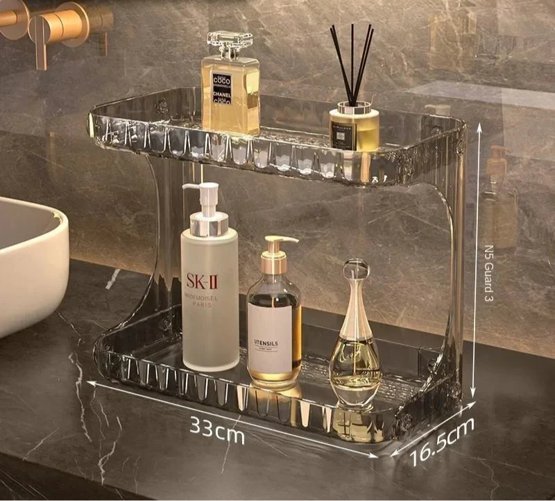 Étagère de salle de bain en acrylique transparent gris cristal, à deux niveaux, affichant ses dimensions (33 cm x 16,5 cm x 23 cm) – idéale pour organiser cosmétiques, savons et parfums